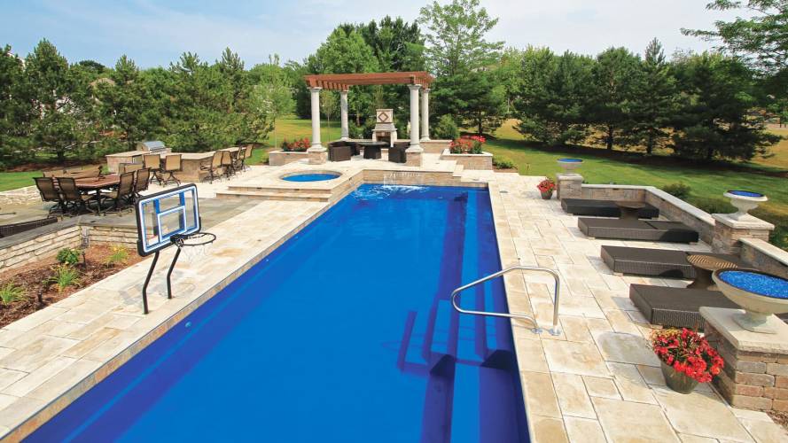 Large, 30 foot rectangular pool with spa, basketball hoop and backboard, plus hardscaped outdoor kitchen